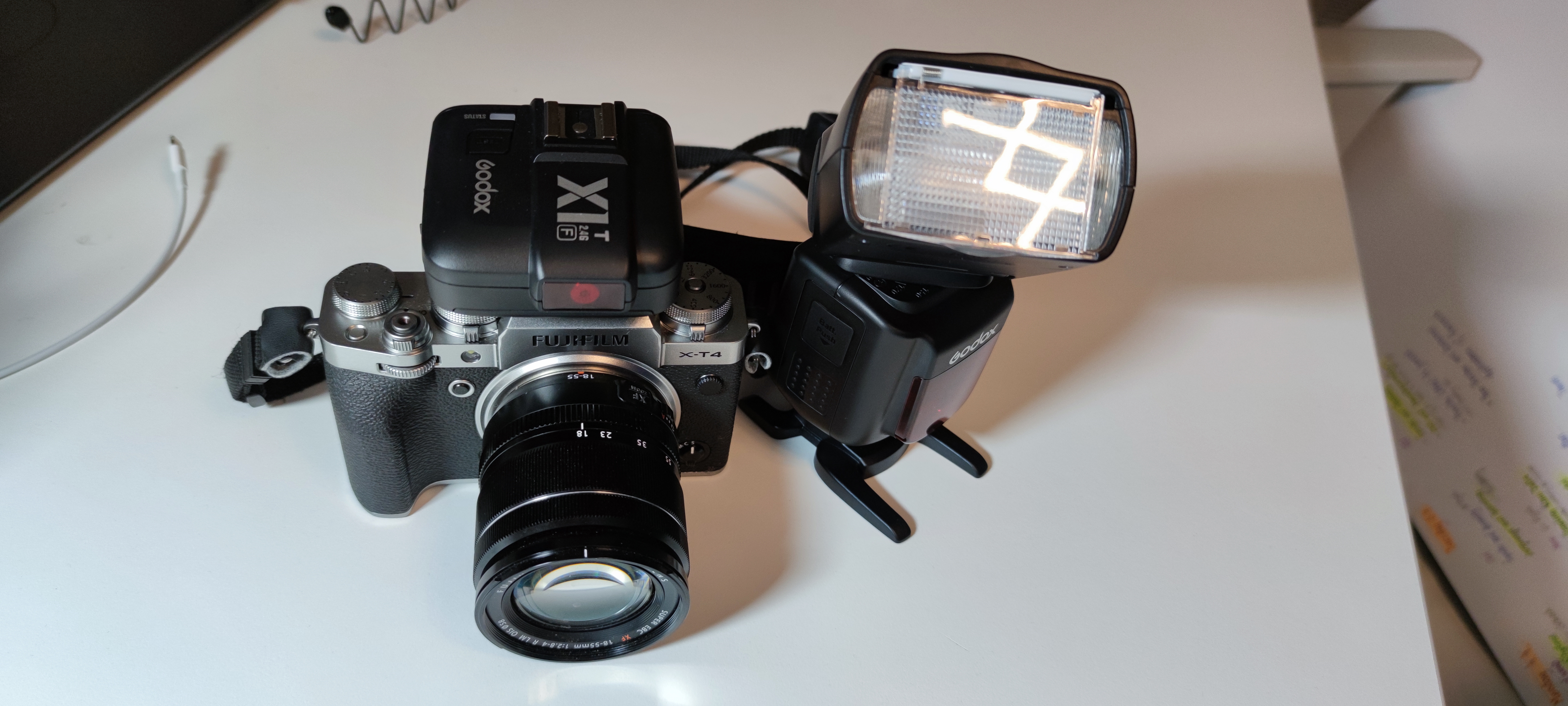 A Fujifilm camera, X-T4, with Godox V860IIF flash and a Godox GX1 remote trigger